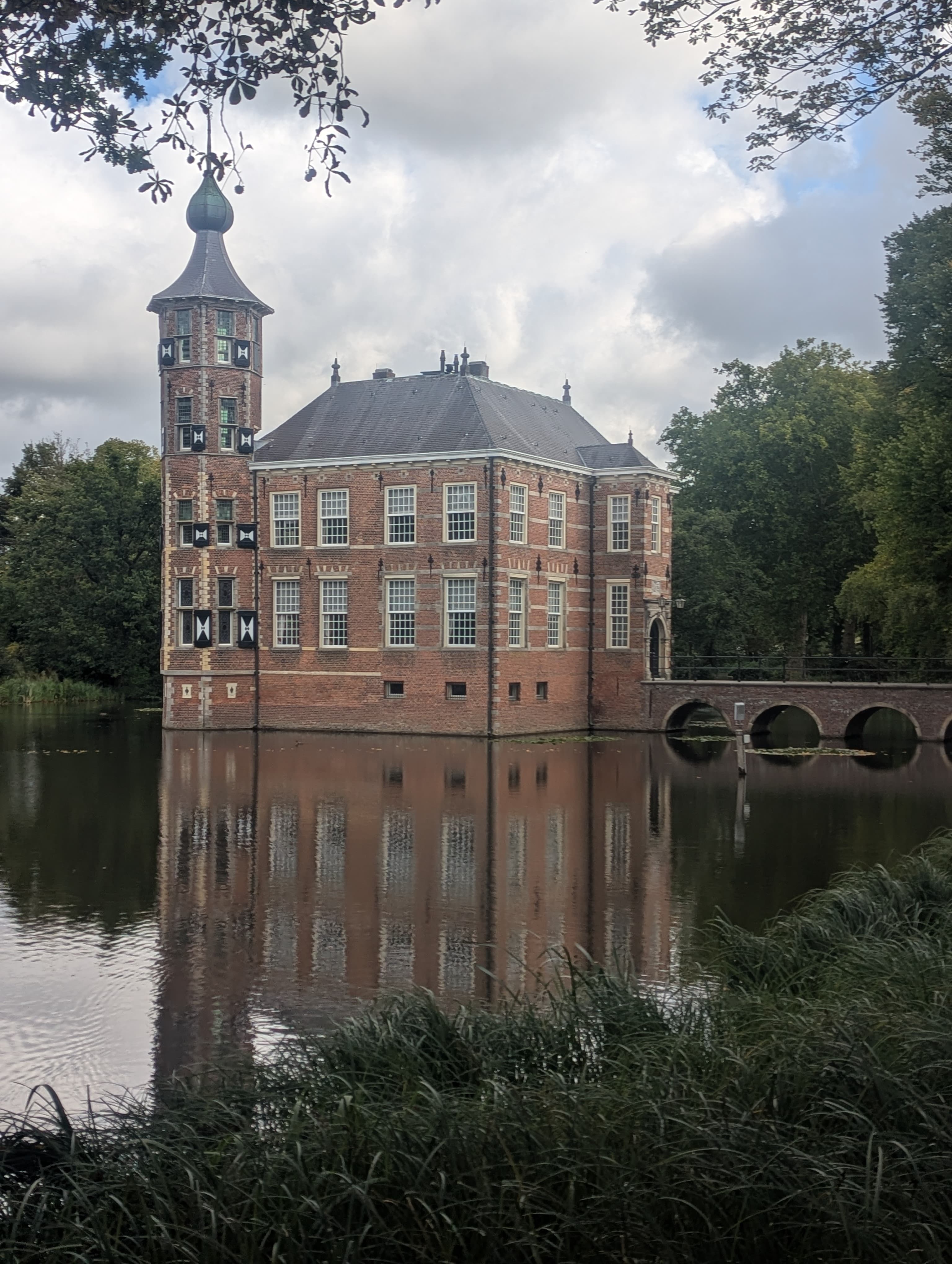 Historic castle reflected in water - representing established expertise and thoughtful reflection