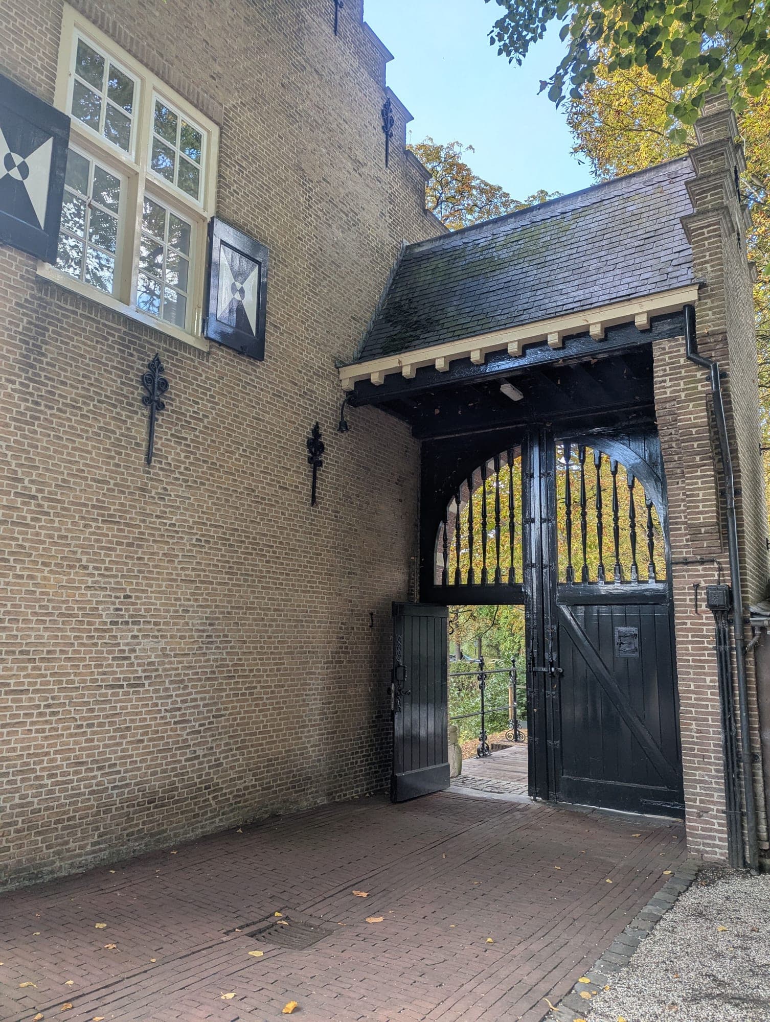 A stone gatehouse at the entrance to an estate, the point where security is decided.