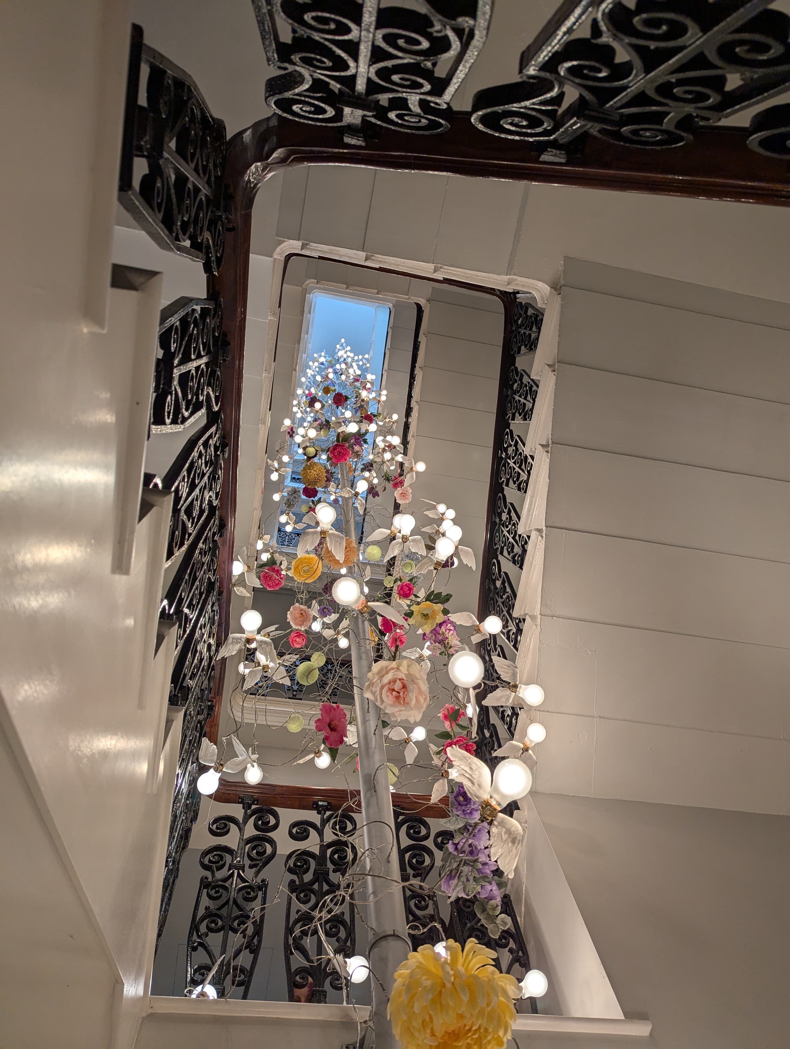 Spiral stairway with decorative lights representing AI innovation and creativity
